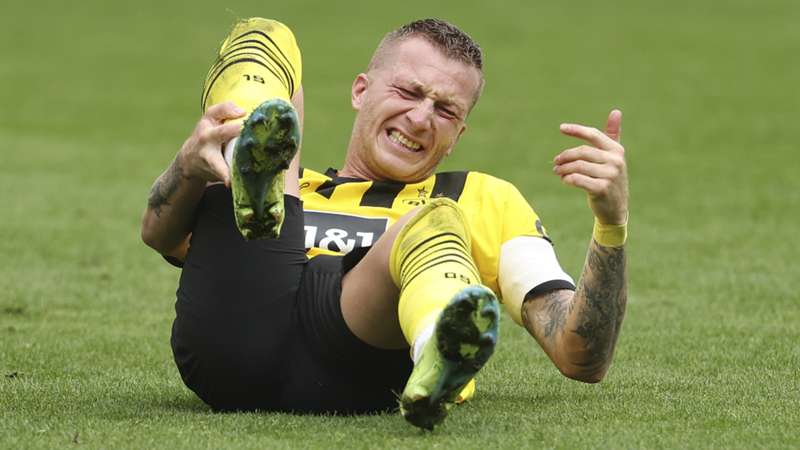 Marco Reus faces World Cup wait after Dortmund captain suffers ankle injury in Bundesliga derby win Marco Reus faces World Cup wait after Dortmund captain suffers ankle injury in Bundesliga derby win